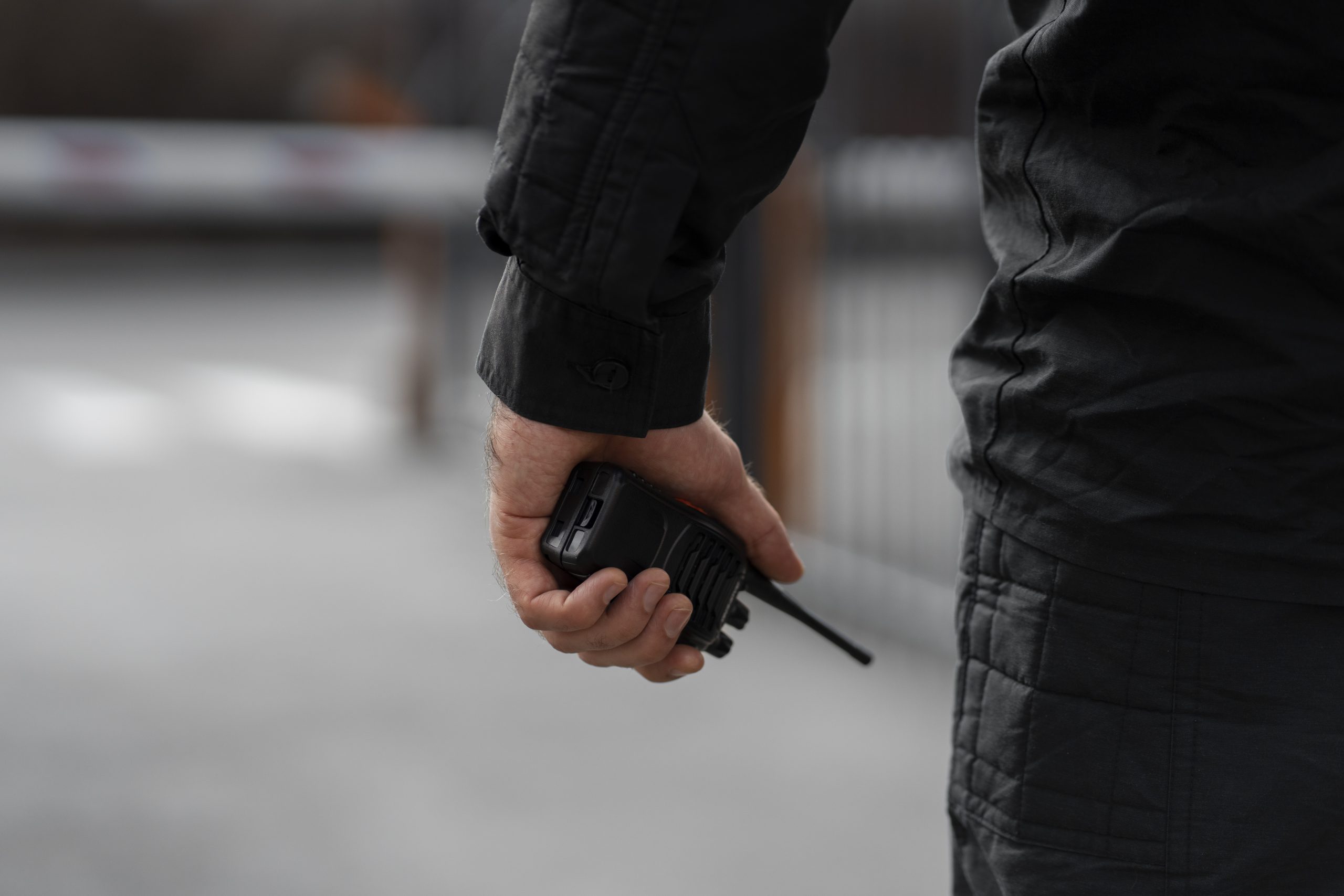 Professional security guard communicating by radio